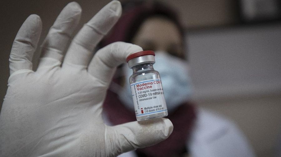 A Palestinian medic displays a vial of the Moderna COVID-19 vaccine, at the health ministry, in the West Bank city of Bethlehem, Wednesday, Feb. 3, 2021. The Palestinian Authority has administered its first known coronavirus vaccinations after receiving several thousands of doses of the Moderna vaccine from Israel. The Pfizer-BioNTech and AstraZeneca vaccines will be provided in the coming weeks through COVAX, a World Health Organization program designed to help poor countries acquire vaccines. (AP Photo/Nasser Nasser)