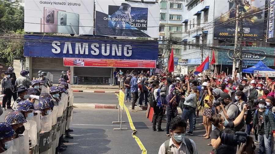 In this image made from video, protesters flash the three-fingered salute while they march Saturday, Feb. 6, 2021, in Yangon, Myanmar. The military authorities in charge of Myanmar broadened a ban on social media following this week’s coup, shutting access to Twitter and Instagram, while street protests continued to expand Saturday as people gathered again to show their opposition to the army takeover. (AP Photo)