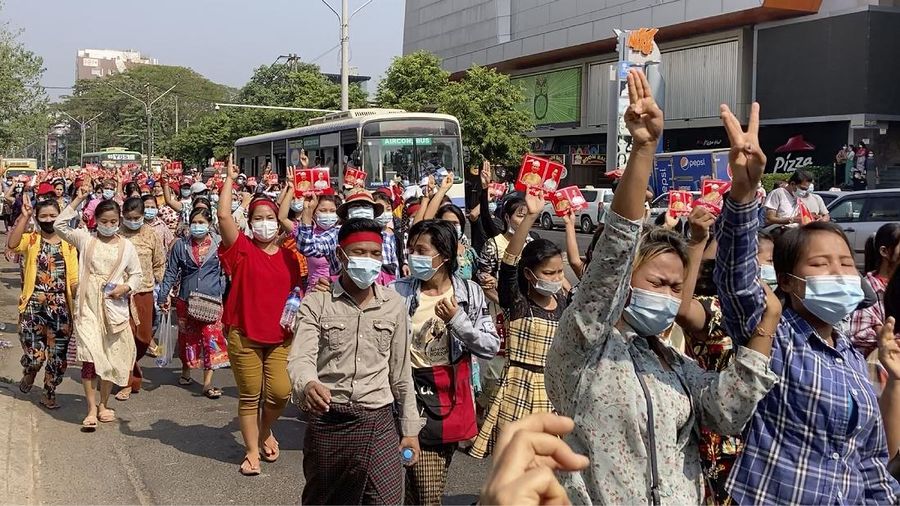 In this image made from video, protesters flash the three-fingered salute while they march Saturday, Feb. 6, 2021, in Yangon, Myanmar. The military authorities in charge of Myanmar broadened a ban on social media following this week’s coup, shutting access to Twitter and Instagram, while street protests continued to expand Saturday as people gathered again to show their opposition to the army takeover. (AP Photo)
