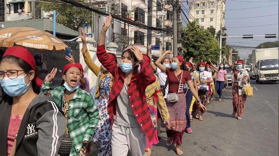 In this image made from video, protesters flash the three-fingered salute while they march Saturday, Feb. 6, 2021, in Yangon, Myanmar. The military authorities in charge of Myanmar broadened a ban on social media following this week’s coup, shutting access to Twitter and Instagram, while street protests continued to expand Saturday as people gathered again to show their opposition to the army takeover. (AP Photo)