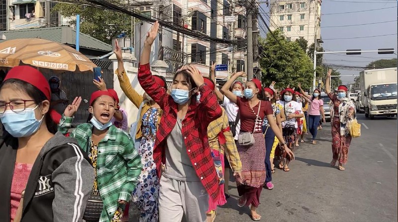 In this image made from video, protesters flash the three-fingered salute while they march Saturday, Feb. 6, 2021, in Yangon, Myanmar. The military authorities in charge of Myanmar broadened a ban on social media following this week’s coup, shutting access to Twitter and Instagram, while street protests continued to expand Saturday as people gathered again to show their opposition to the army takeover. (AP Photo)
