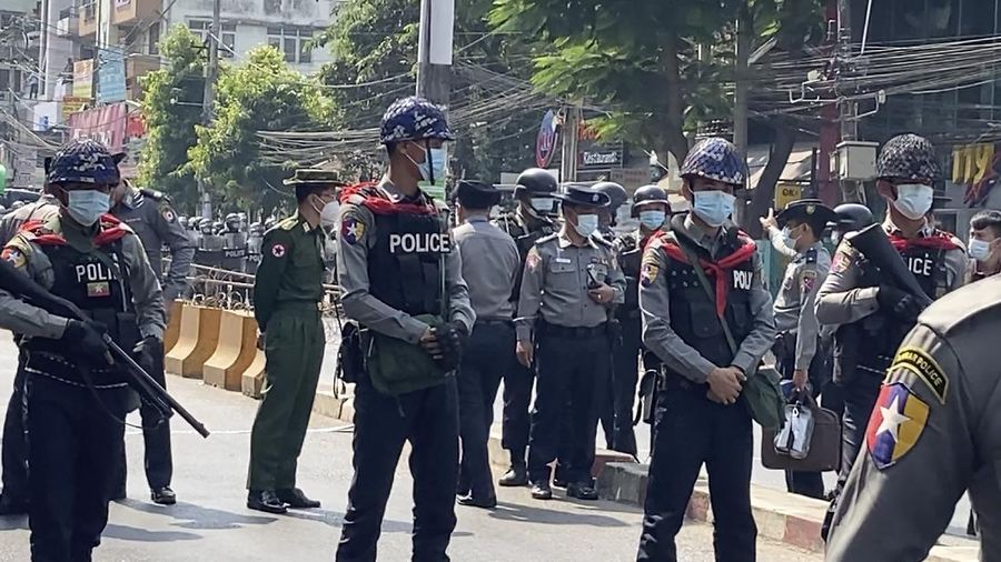 In this image made from video, protesters flash the three-fingered salute while they march Saturday, Feb. 6, 2021, in Yangon, Myanmar. The military authorities in charge of Myanmar broadened a ban on social media following this week’s coup, shutting access to Twitter and Instagram, while street protests continued to expand Saturday as people gathered again to show their opposition to the army takeover. (AP Photo)
