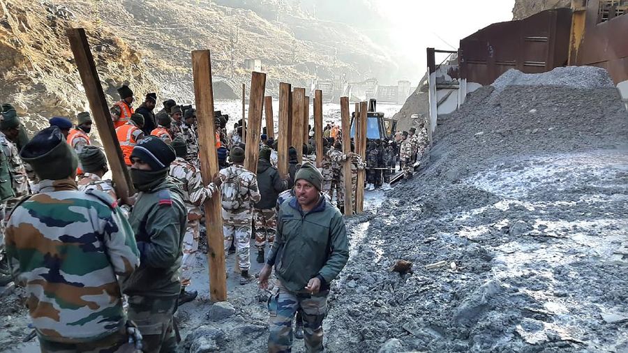 Indo Tibetan Border Police (ITBP) personnel undertake rescue work at one of the hydro power project at Reni village in ​​Chamoli district, in Indian state of Uttrakhund, Monday, Feb.8, 2021. Rescue efforts continued on Monday to save 37 people after part of a glacier broke off, releasing a torrent of water and debris that slammed into two hydroelectric plants on Sunday. (AP Photo)