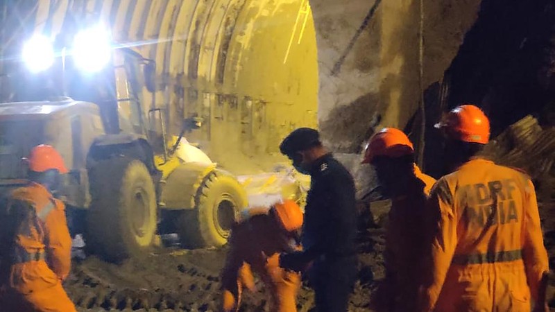 This photograph provided by National Disaster Response Force shows NDRF personnel prepare to rescue workers at one of the hydropower project at Reni village in Chamoli district of Indian state of Uttrakhund, Monday, Feb. 8, 2021. Rescue efforts continued on Monday to save 37 people after part of a glacier broke off, releasing a torrent of water and debris that slammed into two hydroelectric plants on Sunday. (National Disaster Response Force via AP)