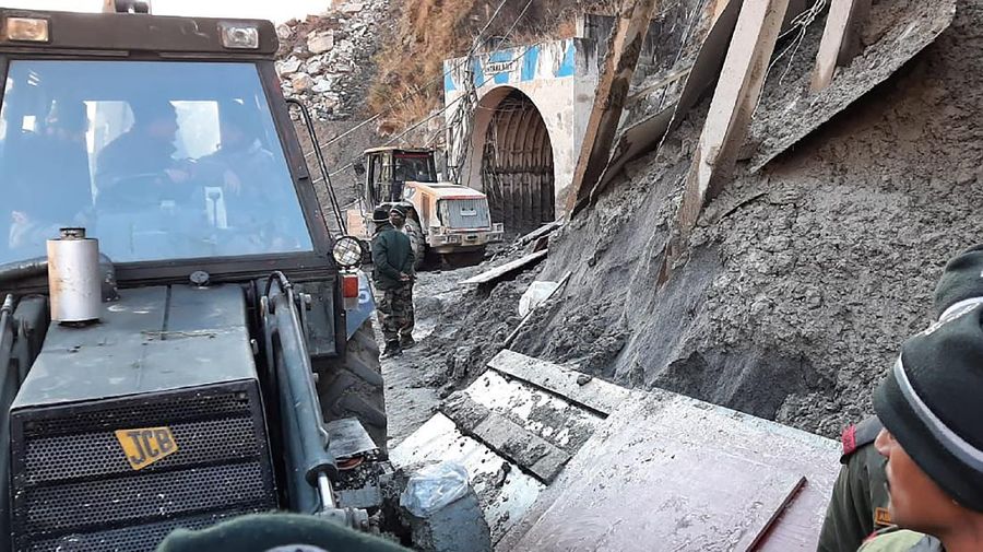 This photograph provided by National Disaster Response Force shows NDRF personnel prepare to rescue workers at one of the hydropower project at Reni village in Chamoli district of Indian state of Uttrakhund, Monday, Feb. 8, 2021. Rescue efforts continued on Monday to save 37 people after part of a glacier broke off, releasing a torrent of water and debris that slammed into two hydroelectric plants on Sunday. (National Disaster Response Force via AP)