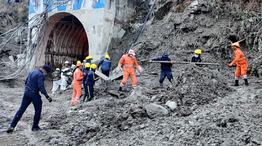 This photograph provided by National Disaster Response Force shows NDRF personnel prepare to rescue workers at one of the hydropower project at Reni village in Chamoli district of Indian state of Uttrakhund, Monday, Feb. 8, 2021. Rescue efforts continued on Monday to save 37 people after part of a glacier broke off, releasing a torrent of water and debris that slammed into two hydroelectric plants on Sunday. (National Disaster Response Force via AP)