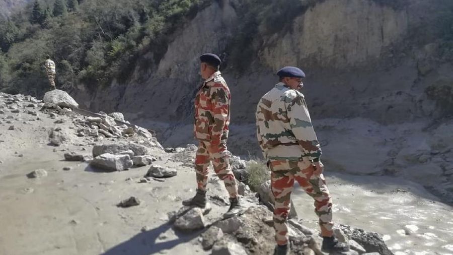 This photograph provided by Indo Tibetan Border Police (ITBP) shows ITBP personnel arriving for rescue work after a portion of Nanda Devi glacier broke off in Tapovan area of the northern state of Uttarakhand sending a massive flood of water, mud and debris into areas below, India, Sunday, Feb.7, 2021. (Indo Tibetan Border Police via AP)