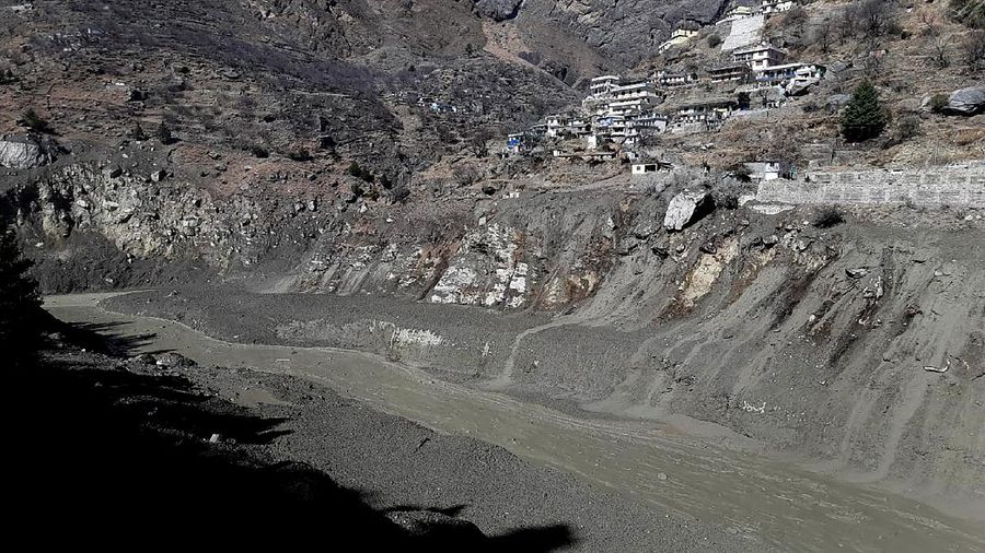 This photograph provided by Indo Tibetan Border Police (ITBP) shows ITBP personnel arriving for rescue work after a portion of Nanda Devi glacier broke off in Tapovan area of the northern state of Uttarakhand sending a massive flood of water, mud and debris into areas below, India, Sunday, Feb.7, 2021. (Indo Tibetan Border Police via AP)