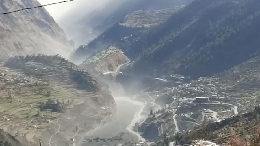 This photograph provided by Indo Tibetan Border Police (ITBP) shows ITBP personnel arriving for rescue work after a portion of Nanda Devi glacier broke off in Tapovan area of the northern state of Uttarakhand sending a massive flood of water, mud and debris into areas below, India, Sunday, Feb.7, 2021. (Indo Tibetan Border Police via AP)
