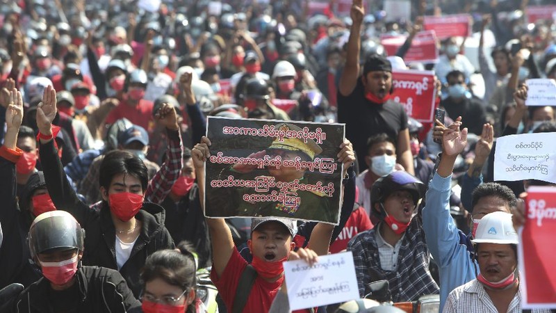 A crowd of protesters fill a street and a bridge in Mandalay, Myanmar on Sunday, Feb. 7, 2021. Tens of thousands of people rallied against the military takeover in Myanmar's biggest city on Yangon Sunday and demanded the release of Aung San Suu Kyi, whose elected government was toppled by the army that also imposed an internet blackout. (AP Photo)