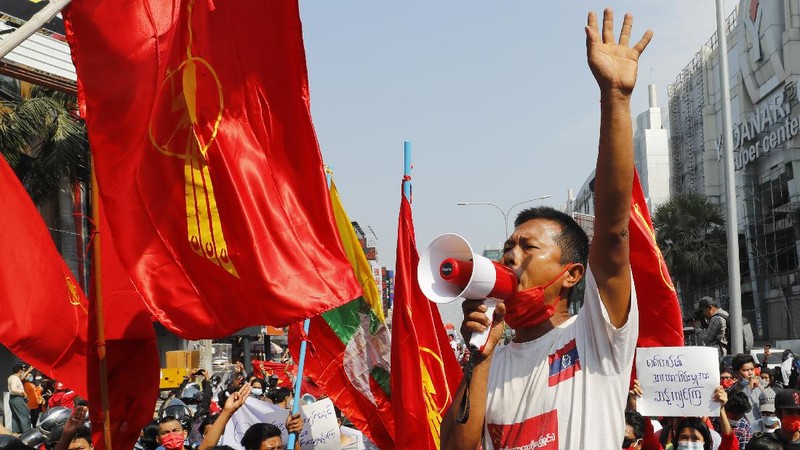 A crowd of protesters fill a street and a bridge in Mandalay, Myanmar on Sunday, Feb. 7, 2021. Tens of thousands of people rallied against the military takeover in Myanmar's biggest city on Yangon Sunday and demanded the release of Aung San Suu Kyi, whose elected government was toppled by the army that also imposed an internet blackout. (AP Photo)