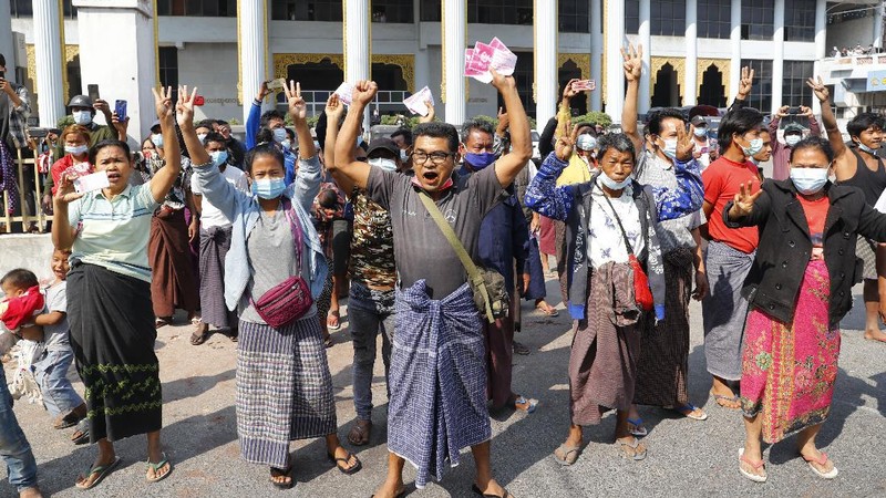 A crowd of protesters fill a street and a bridge in Mandalay, Myanmar on Sunday, Feb. 7, 2021. Tens of thousands of people rallied against the military takeover in Myanmar's biggest city on Yangon Sunday and demanded the release of Aung San Suu Kyi, whose elected government was toppled by the army that also imposed an internet blackout. (AP Photo)