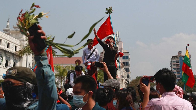 A crowd of protesters fill a street and a bridge in Mandalay, Myanmar on Sunday, Feb. 7, 2021. Tens of thousands of people rallied against the military takeover in Myanmar's biggest city on Yangon Sunday and demanded the release of Aung San Suu Kyi, whose elected government was toppled by the army that also imposed an internet blackout. (AP Photo)