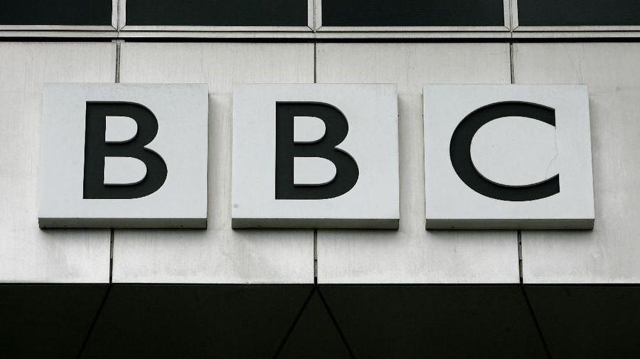 FILE - This Oct. 17, 2007, file photo, shows the BBC, British Broadcasting Corporation sign on their offices at White City in London. China has banned the BBC World News television channel from the few outlets where it could be seen in the country in possible retaliation after British regulators revoked the license of state-owned Chinese broadcaster CGTN. (AP Photo/Kirsty Wigglesworth, File)