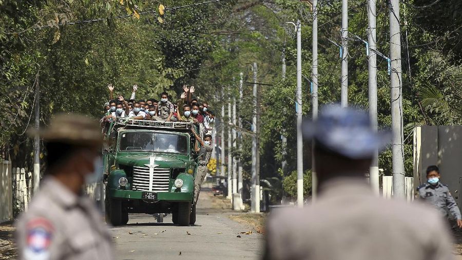 Prisoners, soon to be released marking the 74th anniversary of Myanmar's Union Day, wait for processing at the Insein prison in Yangon, Myanmar Friday, Feb. 12, 2021. Myanmar's coup leader used the country's Union Day holiday on Friday to call on people to work with the military if they want democracy, a request likely to be met with derision by protesters who are pushing for the release from detention of their country's elected leaders. (AP Photo)