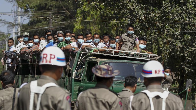 Prisoners, soon to be released marking the 74th anniversary of Myanmar's Union Day, wait for processing at the Insein prison in Yangon, Myanmar Friday, Feb. 12, 2021. Myanmar's coup leader used the country's Union Day holiday on Friday to call on people to work with the military if they want democracy, a request likely to be met with derision by protesters who are pushing for the release from detention of their country's elected leaders. (AP Photo)