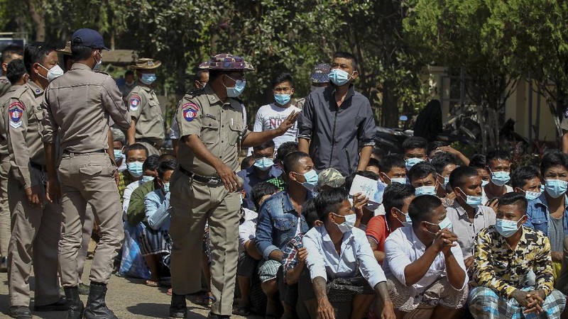 Prisoners, soon to be released marking the 74th anniversary of Myanmar's Union Day, wait for processing at the Insein prison in Yangon, Myanmar Friday, Feb. 12, 2021. Myanmar's coup leader used the country's Union Day holiday on Friday to call on people to work with the military if they want democracy, a request likely to be met with derision by protesters who are pushing for the release from detention of their country's elected leaders. (AP Photo)
