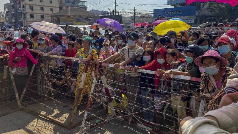 Prisoners, soon to be released marking the 74th anniversary of Myanmar's Union Day, wait for processing at the Insein prison in Yangon, Myanmar Friday, Feb. 12, 2021. Myanmar's coup leader used the country's Union Day holiday on Friday to call on people to work with the military if they want democracy, a request likely to be met with derision by protesters who are pushing for the release from detention of their country's elected leaders. (AP Photo)