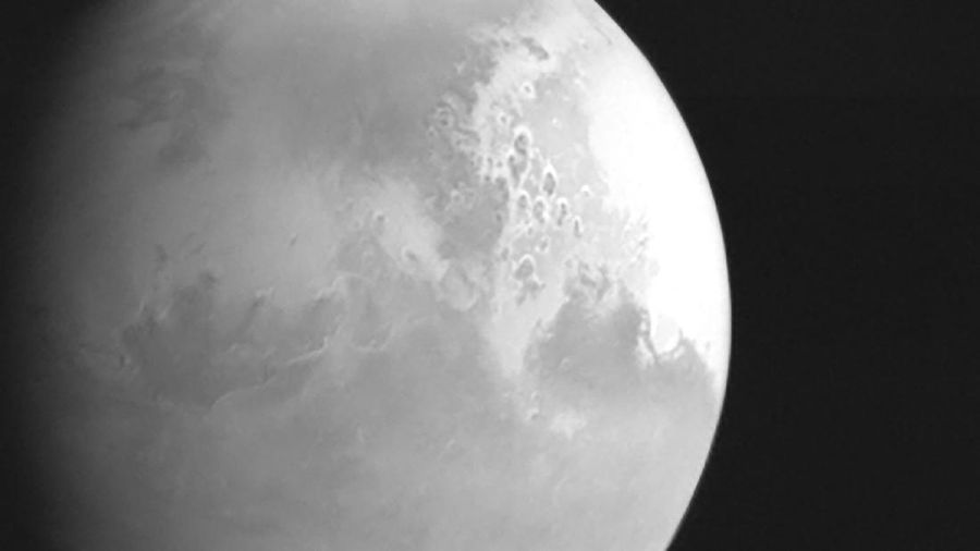 In this undated photo released by the China National Space Administration, a view of the planet Mars is captured by China's Tianwen-1 Mars probe from a distance of 2.2 million kilometers (1.37 million miles). A Chinese spacecraft appears poised to enter orbit around Mars on Wednesday, Feb. 10, 2021, one day after an orbiter from the United Arab Emirates did so, and about a week ahead of an American attempt to put down another spacecraft on the surface of the red planet. (CNSA/Xinhua via AP)
