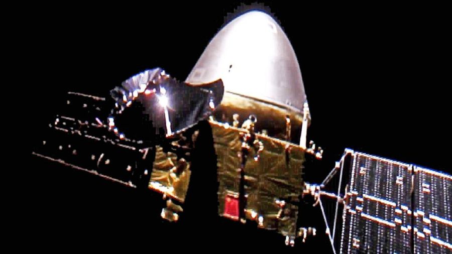 In this July 23, 2020, file photo released by China's Xinhua News Agency, spectators watch as a Long March-5 rocket carrying the Tianwen-1 Mars probe lifts off from the Wenchang Space Launch Center in southern China's Hainan Province. China is falling in love with space, inspired by the ruling Communist Party's increasingly ambitious missions over the past two decades to fire humans into orbit and explore the moon and Mars. (Yang Guanyu/Xinhua via AP, File)