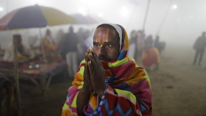 Tents for devotees cover the area at the Sangam, the confluence of the rivers Ganges and the Yamuna on 'Mauni Amavasya' or new moon day, an auspicious bathing day during the annual month long Hindu religious fair 