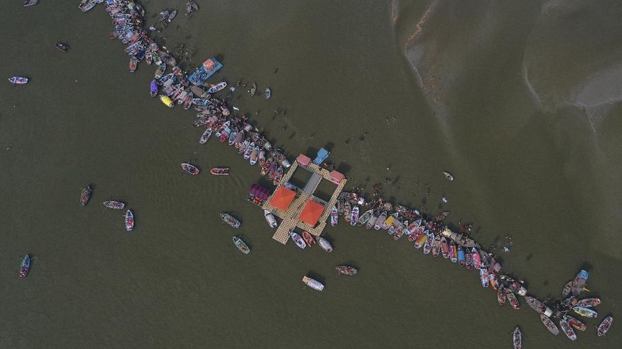 Tents for devotees cover the area at the Sangam, the confluence of the rivers Ganges and the Yamuna on 'Mauni Amavasya' or new moon day, an auspicious bathing day during the annual month long Hindu religious fair 