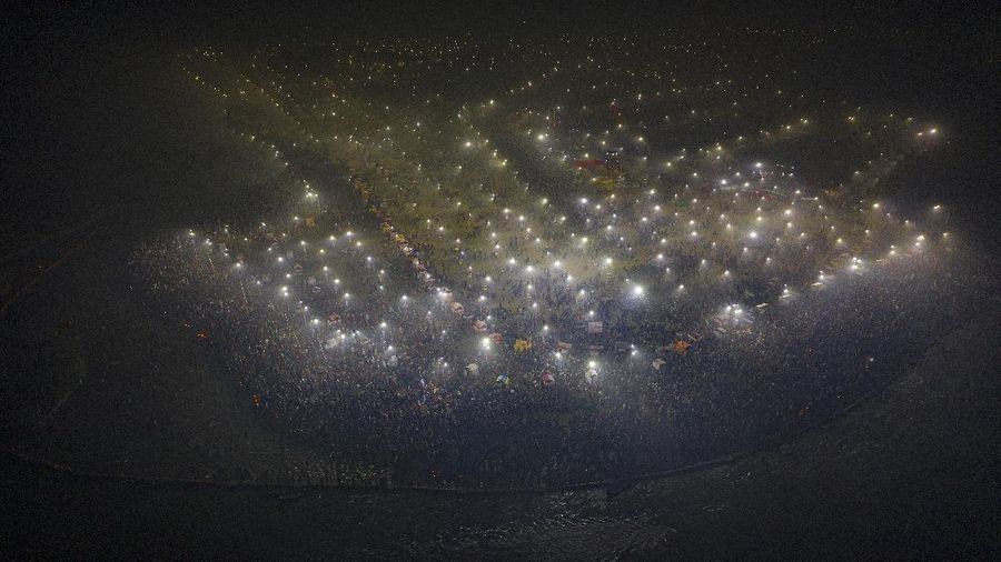 Tents for devotees cover the area at the Sangam, the confluence of the rivers Ganges and the Yamuna on 'Mauni Amavasya' or new moon day, an auspicious bathing day during the annual month long Hindu religious fair 