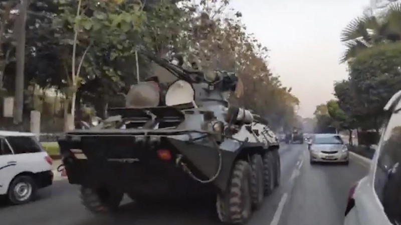 In this image made from video by the Democratic Voice of Burma (DVB), two armored personnel carriers were seen traversing on a road in Yangon, Myanmar, Sunday, Feb. 14, 2021. Sightings of armored personnel carriers in Myanmar’s biggest city and an internet shutdown raised political tensions late Sunday, after vast numbers of people around the country flouted orders against demonstrations to protest the military’s seizure of power. (DVB via AP)