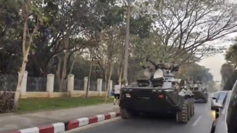 In this image made from video by the Democratic Voice of Burma (DVB), two armored personnel carriers were seen traversing on a road in Yangon, Myanmar, Sunday, Feb. 14, 2021. Sightings of armored personnel carriers in Myanmar’s biggest city and an internet shutdown raised political tensions late Sunday, after vast numbers of people around the country flouted orders against demonstrations to protest the military’s seizure of power. (DVB via AP)