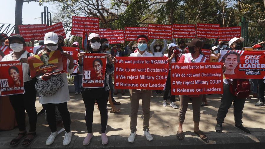 In this image made from video by the Democratic Voice of Burma (DVB), two armored personnel carriers were seen traversing on a road in Yangon, Myanmar, Sunday, Feb. 14, 2021. Sightings of armored personnel carriers in Myanmar’s biggest city and an internet shutdown raised political tensions late Sunday, after vast numbers of people around the country flouted orders against demonstrations to protest the military’s seizure of power. (DVB via AP)