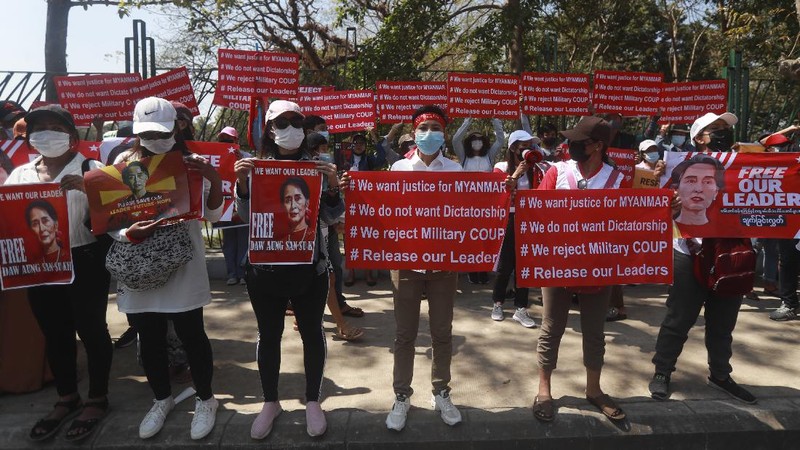 In this image made from video by the Democratic Voice of Burma (DVB), two armored personnel carriers were seen traversing on a road in Yangon, Myanmar, Sunday, Feb. 14, 2021. Sightings of armored personnel carriers in Myanmar’s biggest city and an internet shutdown raised political tensions late Sunday, after vast numbers of people around the country flouted orders against demonstrations to protest the military’s seizure of power. (DVB via AP)