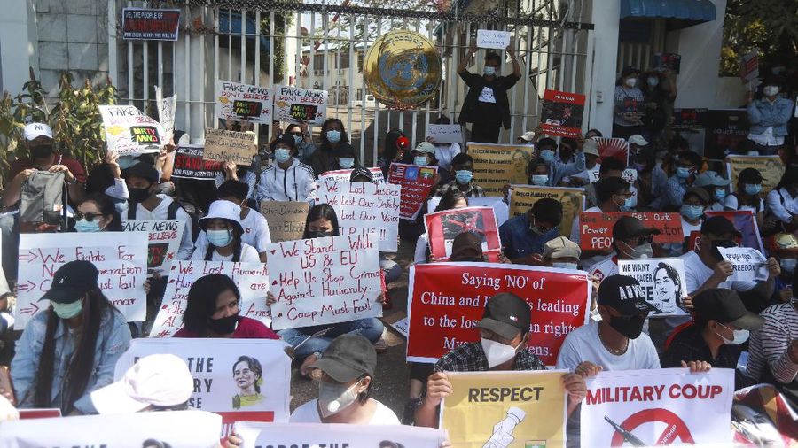 In this image made from video by the Democratic Voice of Burma (DVB), two armored personnel carriers were seen traversing on a road in Yangon, Myanmar, Sunday, Feb. 14, 2021. Sightings of armored personnel carriers in Myanmar’s biggest city and an internet shutdown raised political tensions late Sunday, after vast numbers of people around the country flouted orders against demonstrations to protest the military’s seizure of power. (DVB via AP)