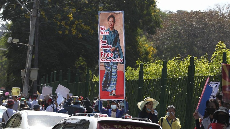 In this image made from video by the Democratic Voice of Burma (DVB), two armored personnel carriers were seen traversing on a road in Yangon, Myanmar, Sunday, Feb. 14, 2021. Sightings of armored personnel carriers in Myanmar’s biggest city and an internet shutdown raised political tensions late Sunday, after vast numbers of people around the country flouted orders against demonstrations to protest the military’s seizure of power. (DVB via AP)