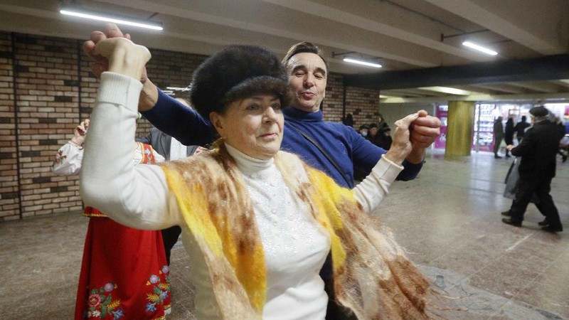 Elderly people dance in a pedestrian subway to mark Valentine's Day ignoring coronavirus quarantine restrictions in Kyiv, Ukraine, Sunday, Feb. 14, 2021. (AP Photo/Efrem Lukatsky)
