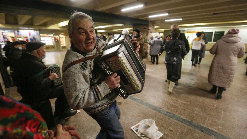 Elderly people dance in a pedestrian subway to mark Valentine's Day ignoring coronavirus quarantine restrictions in Kyiv, Ukraine, Sunday, Feb. 14, 2021. (AP Photo/Efrem Lukatsky)