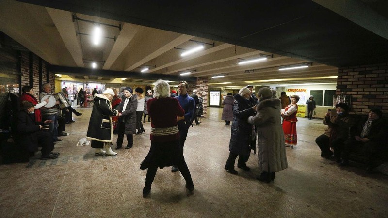 Elderly people dance in a pedestrian subway to mark Valentine's Day ignoring coronavirus quarantine restrictions in Kyiv, Ukraine, Sunday, Feb. 14, 2021. (AP Photo/Efrem Lukatsky)