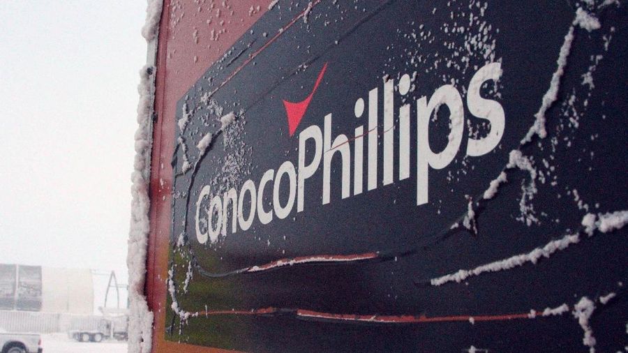 FILE - This Feb. 9, 2016, file photo shows an ice-covered ConocoPhillips sign at the Colville-Delta 5, or as it's more commonly known, CD5, drilling site on Alaska's North Slope. ConocoPhillips reports financial results Thursday, April 28, 2016. (AP Photo/Mark Thiessen, File)