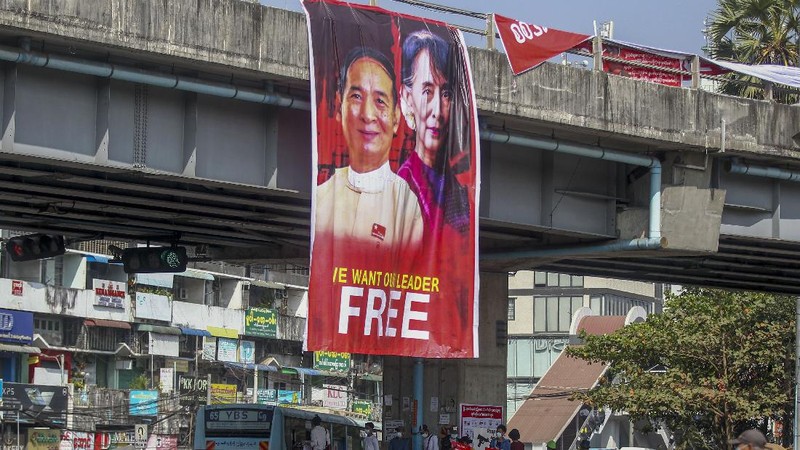 Demonstrators display images of detained Myanmar leader Aung San Suu Kyi during a protest against the military coup in Yangon, Myanmar Tuesday, Feb. 16, 2021. Security forces in Myanmar pointed guns toward anti-coup protesters and attacked them with sticks Monday, seeking to quell the large-scale demonstrations calling for the military junta that seized power this month to reinstate the elected government. (AP Photo)