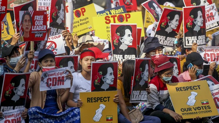Myanmar Demonstrators display images of detained Myanmar leader Aung San Suu Kyi during a protest against the military coup in Yangon, Myanmar Tuesday, Feb. 16, 2021. Security forces in Myanmar pointed guns toward anti-coup protesters and attacked them with sticks Monday, seeking to quell the large-scale demonstrations calling for the military junta that seized power this month to reinstate the elected government. (AP Photo)