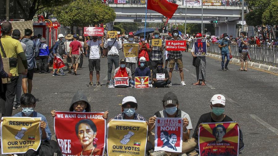 Demonstrators gather in an intersection close to Sule Pagoda to protest against the military coup in Yangon, Myanmar Wednesday, Feb. 17, 2021. The U.N. expert on human rights in Myanmar warned of the prospect for major violence as demonstrators gather again Wednesday to protest the military's seizure of power. (AP Photo)