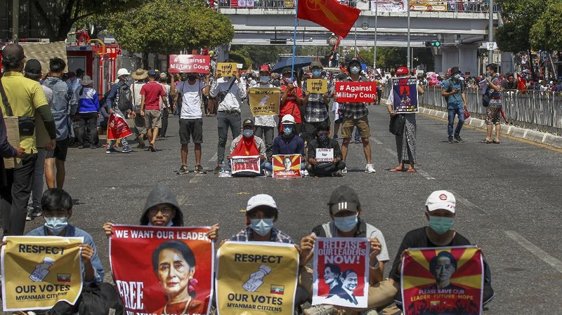 Demonstrators gather in an intersection close to Sule Pagoda to protest against the military coup in Yangon, Myanmar Wednesday, Feb. 17, 2021. The U.N. expert on human rights in Myanmar warned of the prospect for major violence as demonstrators gather again Wednesday to protest the military's seizure of power. (AP Photo)