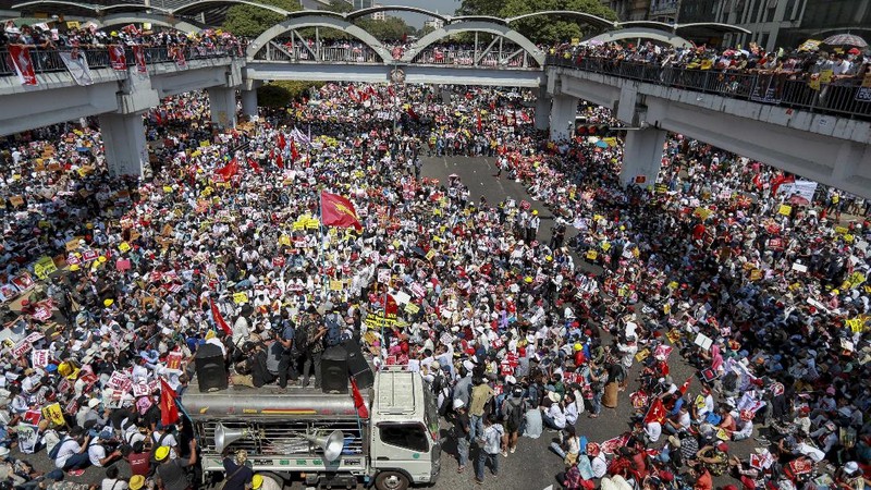 Demonstrators gather in an intersection close to Sule Pagoda to protest against the military coup in Yangon, Myanmar Wednesday, Feb. 17, 2021. The U.N. expert on human rights in Myanmar warned of the prospect for major violence as demonstrators gather again Wednesday to protest the military's seizure of power. (AP Photo)