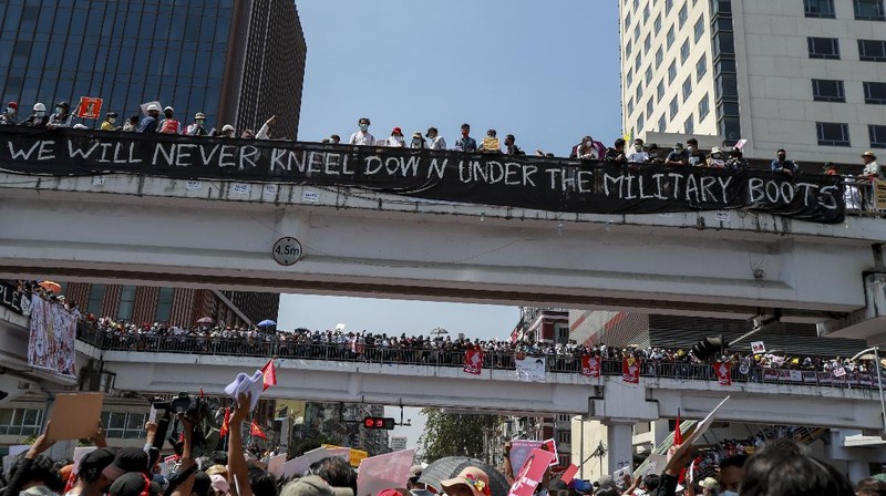 Demonstrators gather in an intersection close to Sule Pagoda to protest against the military coup in Yangon, Myanmar Wednesday, Feb. 17, 2021. The U.N. expert on human rights in Myanmar warned of the prospect for major violence as demonstrators gather again Wednesday to protest the military's seizure of power. (AP Photo)