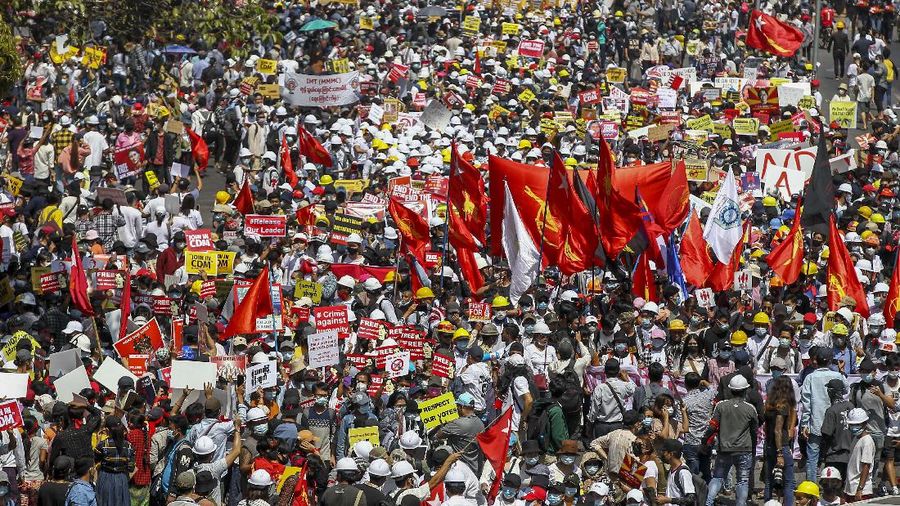 Demonstrators gather in an intersection close to Sule Pagoda to protest against the military coup in Yangon, Myanmar Wednesday, Feb. 17, 2021. The U.N. expert on human rights in Myanmar warned of the prospect for major violence as demonstrators gather again Wednesday to protest the military's seizure of power. (AP Photo)