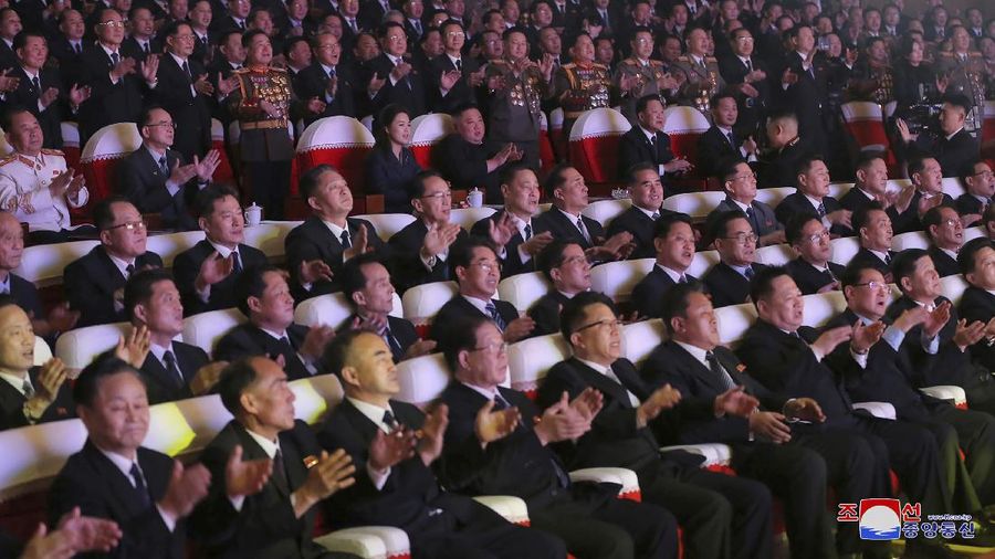 In this photo provided by the North Korean government, North Korean leader Kim Jong Un, center, and his wife Ri Sol Ju watch a performance marking the birth anniversary of former leader Kim Jong Il, in Pyongyang, North Korea, Tuesday, Feb. 16, 2021. Ri has reappeared in North Korea's state media for the first time in just over year. Independent journalists were not given access to cover the event depicted in this image distributed by the North Korean government. The content of this image is as provided and cannot be independently verified. Korean language watermark on image as provided by source reads: 