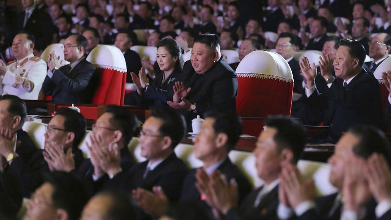 In this photo provided by the North Korean government, North Korean leader Kim Jong Un, center, and his wife Ri Sol Ju watch a performance marking the birth anniversary of former leader Kim Jong Il, in Pyongyang, North Korea, Tuesday, Feb. 16, 2021. Ri has reappeared in North Korea's state media for the first time in just over year. Independent journalists were not given access to cover the event depicted in this image distributed by the North Korean government. The content of this image is as provided and cannot be independently verified. Korean language watermark on image as provided by source reads: 
