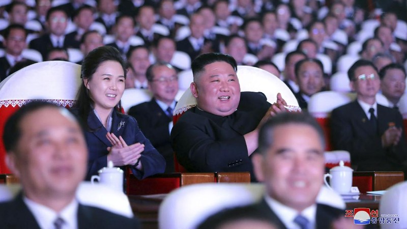 In this photo provided by the North Korean government, North Korean leader Kim Jong Un, center, and his wife Ri Sol Ju watch a performance marking the birth anniversary of former leader Kim Jong Il, in Pyongyang, North Korea, Tuesday, Feb. 16, 2021. Ri has reappeared in North Korea's state media for the first time in just over year. Independent journalists were not given access to cover the event depicted in this image distributed by the North Korean government. The content of this image is as provided and cannot be independently verified. Korean language watermark on image as provided by source reads: 