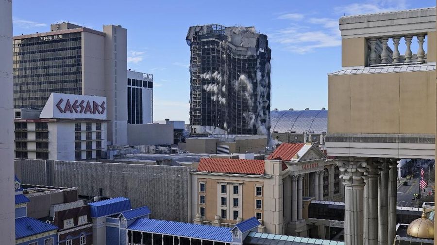 The former Trump Plaza Hotel & Casino implodes in Atlantic City, N.J., Wednesday, Feb 17, 2021.The former Trump Plaza casino was imploded after falling into such disrepair that chunks of the building began peeling off and crashing to the ground.  (Edward Lea/The Press of Atlantic City via AP)
