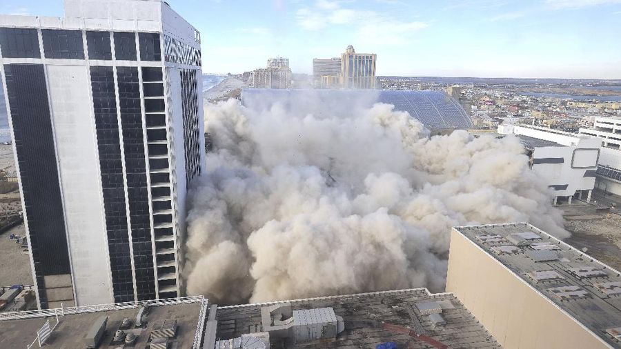 The former Trump Plaza Hotel & Casino implodes in Atlantic City, N.J., Wednesday, Feb 17, 2021.The former Trump Plaza casino was imploded after falling into such disrepair that chunks of the building began peeling off and crashing to the ground.  (Edward Lea/The Press of Atlantic City via AP)