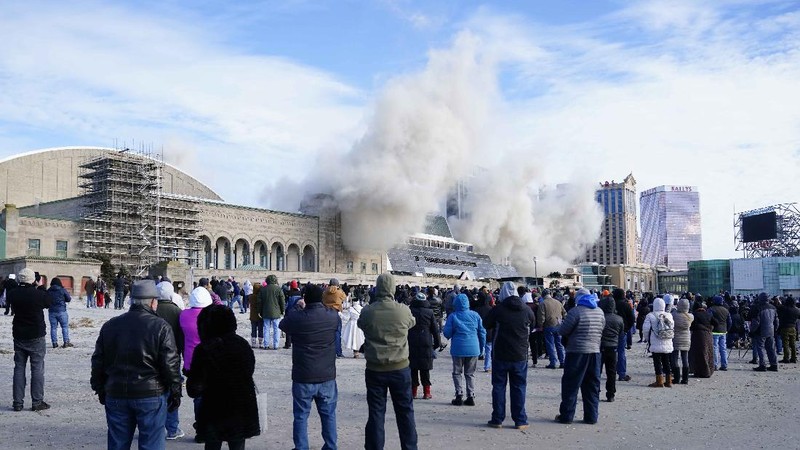 The former Trump Plaza Hotel & Casino implodes in Atlantic City, N.J., Wednesday, Feb 17, 2021.The former Trump Plaza casino was imploded after falling into such disrepair that chunks of the building began peeling off and crashing to the ground.  (Edward Lea/The Press of Atlantic City via AP)